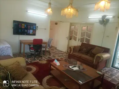a living room with a couch and a table at Decapolis in Irbid