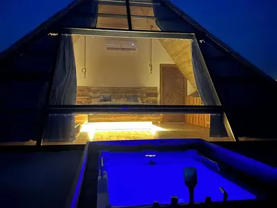 a room with a tub in the middle of a house at Deadsea OCTAGON in Madaba