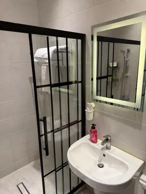 a bathroom with a sink and a mirror at Oak Farm Ajloun مزرعة البلوط عجلون in Ajloun