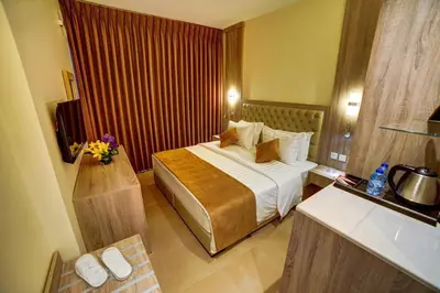 a bedroom with a bed in a hotel room at De-Lara hotel in Aqaba