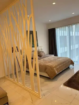 a bedroom with a bed with a wooden frame at Modern studio in the heart of Amman in Amman