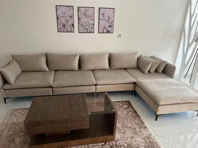 a living room with a couch and a coffee table at Modern studio in the heart of Amman in Amman