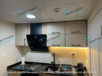 a room with signs on the ceiling of a kitchen at fancy apartment gardens st 410 in Umm Uthainah