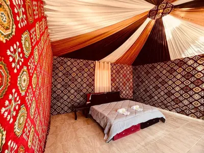 a bedroom with a bed in a tent at Salameh's Bedouin Camp in Wadi Rum