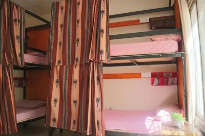 a group of bunk beds in a room at Extra Traveller in Aqaba