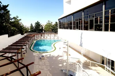a swimming pool on the side of a building at Amman Paradise Hotel in Amman