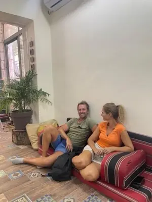 a group of people sitting on a couch at Darna Hostel in Amman