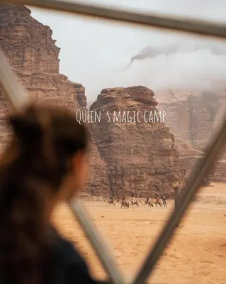 a man looking at a picture of the grand canyon at Queen's Magic Camp in Wadi Rum