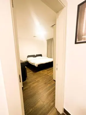 a room with a bedroom with a bed in it at central apartment for rent 25 in Umm Uthainah
