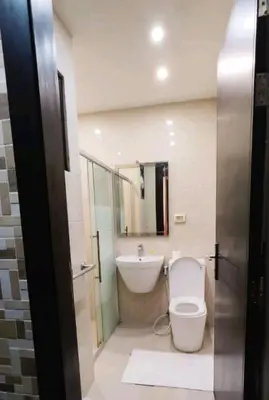 a bathroom with a toilet and a sink at Seven stars hotel apartment in Amman
