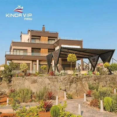a house on a hill with a garden in front of it at Kinda vip in Al Mashāriqah