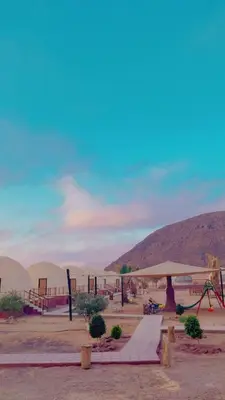 a playground in the middle of a desert with mountains at Bilal luxury camp in Wadi Rum