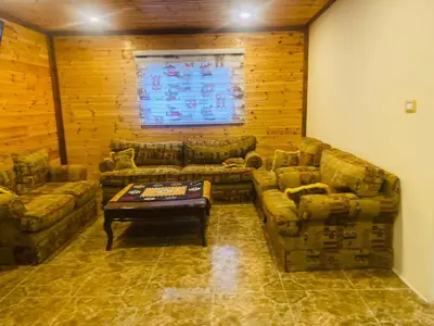 a living room with two couches and a coffee table at North Jewel 2023 in Ajloun