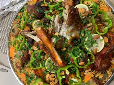a plate of food with vegetables on a table at Petra Hills House in Wadi Musa