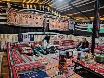 a group of people sitting in a tent at Petra Magic Guest House in Wadi Musa