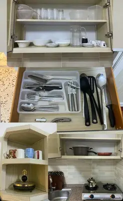 a kitchen with a utensils and a counter top at The vintage apartment in Amman