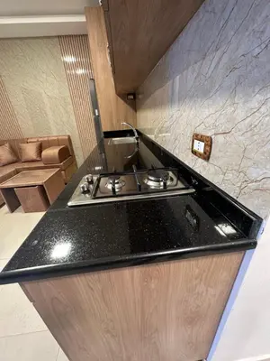 a kitchen with a sink and a counter top at modern 2bedroom for rent Abdoun in Amman