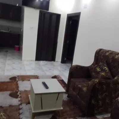 a living room with a couch and a coffee table at dream house hotel in Jerash