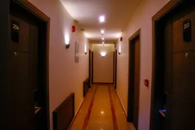 a hallway with a long corridor with lights on it at ِAfnan hotel in Aqaba