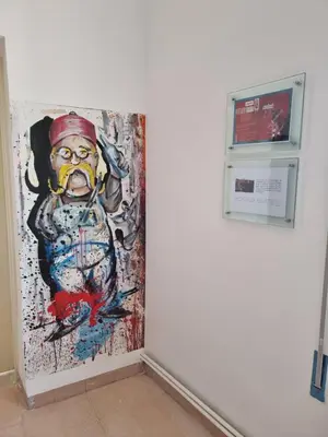 a painting on a wall next to a machine at Downtown Living Boutique Apartments in Amman