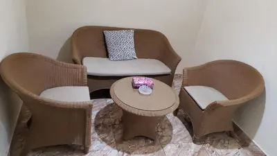 a room with two chairs and a table with a chair at Karam Inn in Aqaba