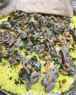 a pizza with mushrooms and nuts in a pan at Little Green Farm in Wadi Musa