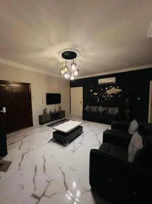 a large living room with a large marble floor at Luxury 4-bedrooms apartment in Aqaba