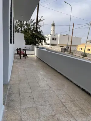 a bench on the roof of a house at Oskar Appartment in Wadi Musa