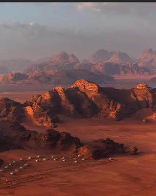 a view of a mountain range with houses and mountains at RUM LEEN BUBBLE lUXURY CAMP in Disah