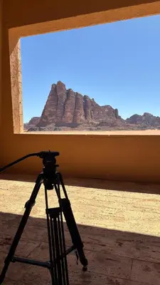 a camera on a tripod in front of a window at Wadi Rum Beyond nature in Wadi Rum