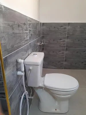 a bathroom with a white toilet in a room at Jerash mountain studio chalet شاليه جبال جرش و عجلون in Jerash
