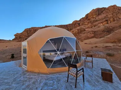 a tent in the middle of the desert at MAXIMAS LUXURY Wadi Rum in Wadi Rum