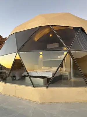 a room in a dome with a bed in it at SELEN RUM LUXURY CAMP & Jeep Tours in Wadi Rum