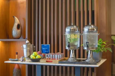 a table with two glass bottles on top of it at Radisson Blu Hotel, Amman Galleria Mall in Amman