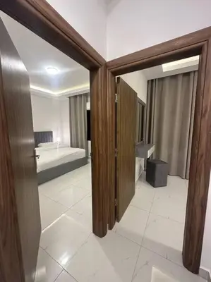 a room with a bedroom with a bed in it at cozy home near all services (19) in Rujm ash Sharāʼirah