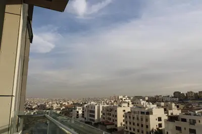 a view of a city from a building at Abdoun luxurious apartment in Amman