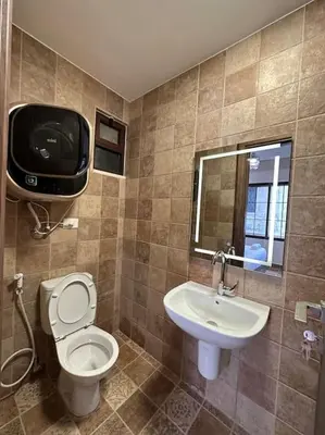 a bathroom with a toilet and a sink at 4/ Antica jabalal-lwebdeh in Amman