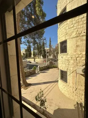a view from a window of a brick building at 5/ Antica jabalal-lwebdeh in Amman