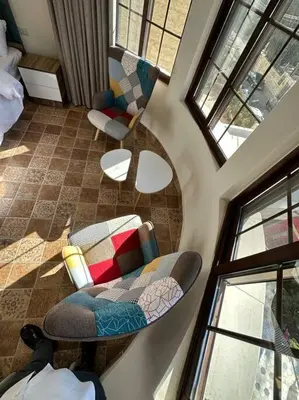 an overhead view of a living room with chairs and windows at 6/ Antica jabalal-lwebdeh in Amman