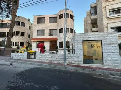 a building on the corner of a city street at 8/ Antica jabalal-lwebdeh in Amman