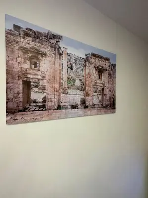 a painting of a building on a wall at XX/ Antica jabalal-lwebdeh in Amman