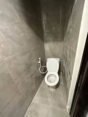 a small bathroom with a toilet in a stall at XX/ Antica jabalal-lwebdeh in Amman