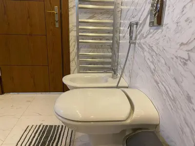 a bathroom with a toilet and a sink at Horizon Villa in Amman