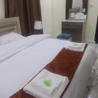 a hotel room with two beds with towels on them at Dream Hotel jerash in Jerash