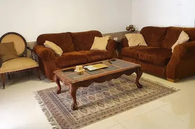 a living room with two couches and a coffee table at ‘C’ DAZZLING MODERN 2 BDRM APT IN KHALDA Free WIFI in Amman