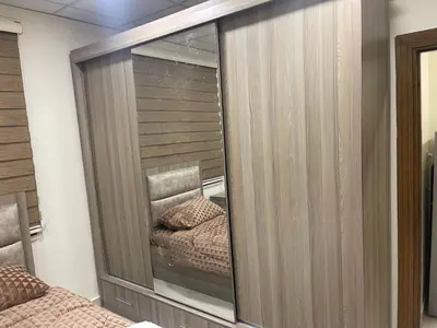 a mirror in a bedroom with a bed in it at Apartment for rent 50M fully furnished - in Amman