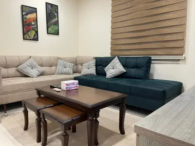 a living room with a couch and a coffee table at Apartment for rent 50M fully furnished - in Amman