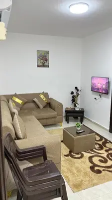 a living room with a couch and a table at Blue Bird House in Wadi Musa