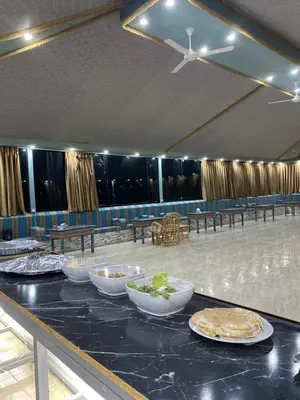 a table with bowls of food on top of it at nature camp in Wadi Rum