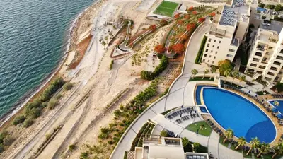 an aerial view of a beach and a resort at E03 Samarah Resort Apartments in Sowayma